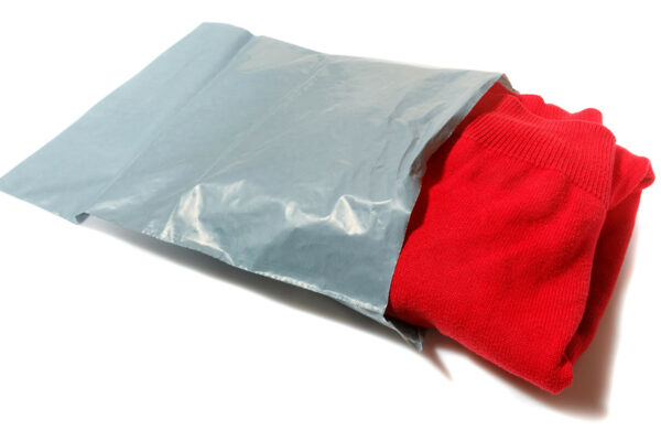 grey-mailing-bag-with-red-jumper